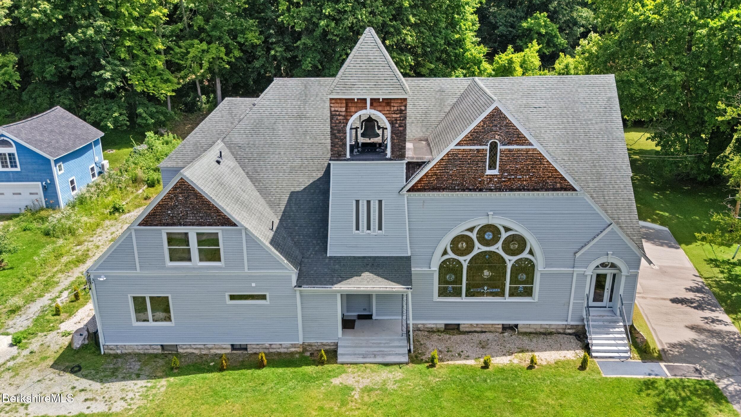 a aerial view of a house with a yard