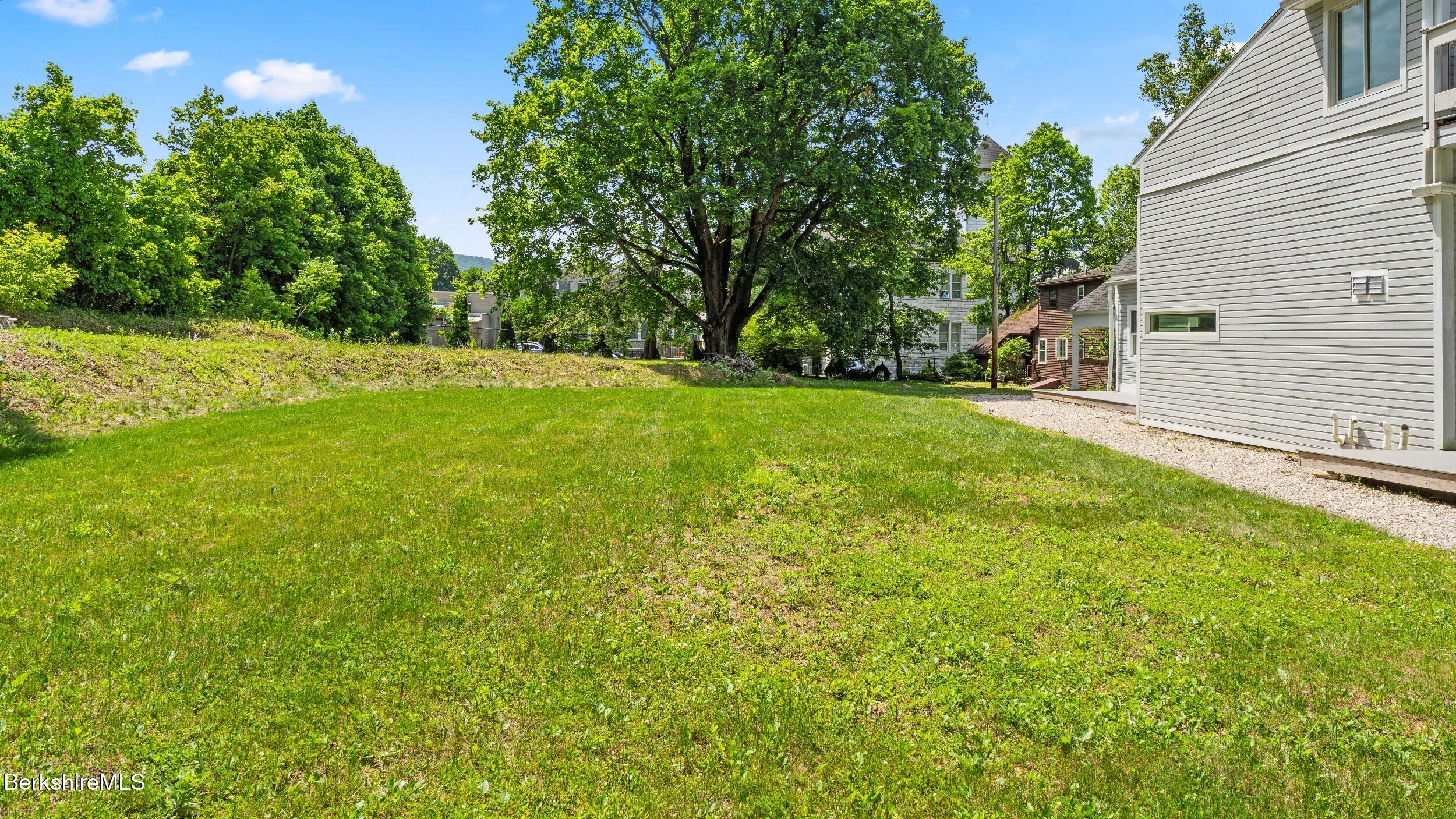 160 High Street Lee, MA 01238 - Photo 13 of 68 a view of a backyard with large trees