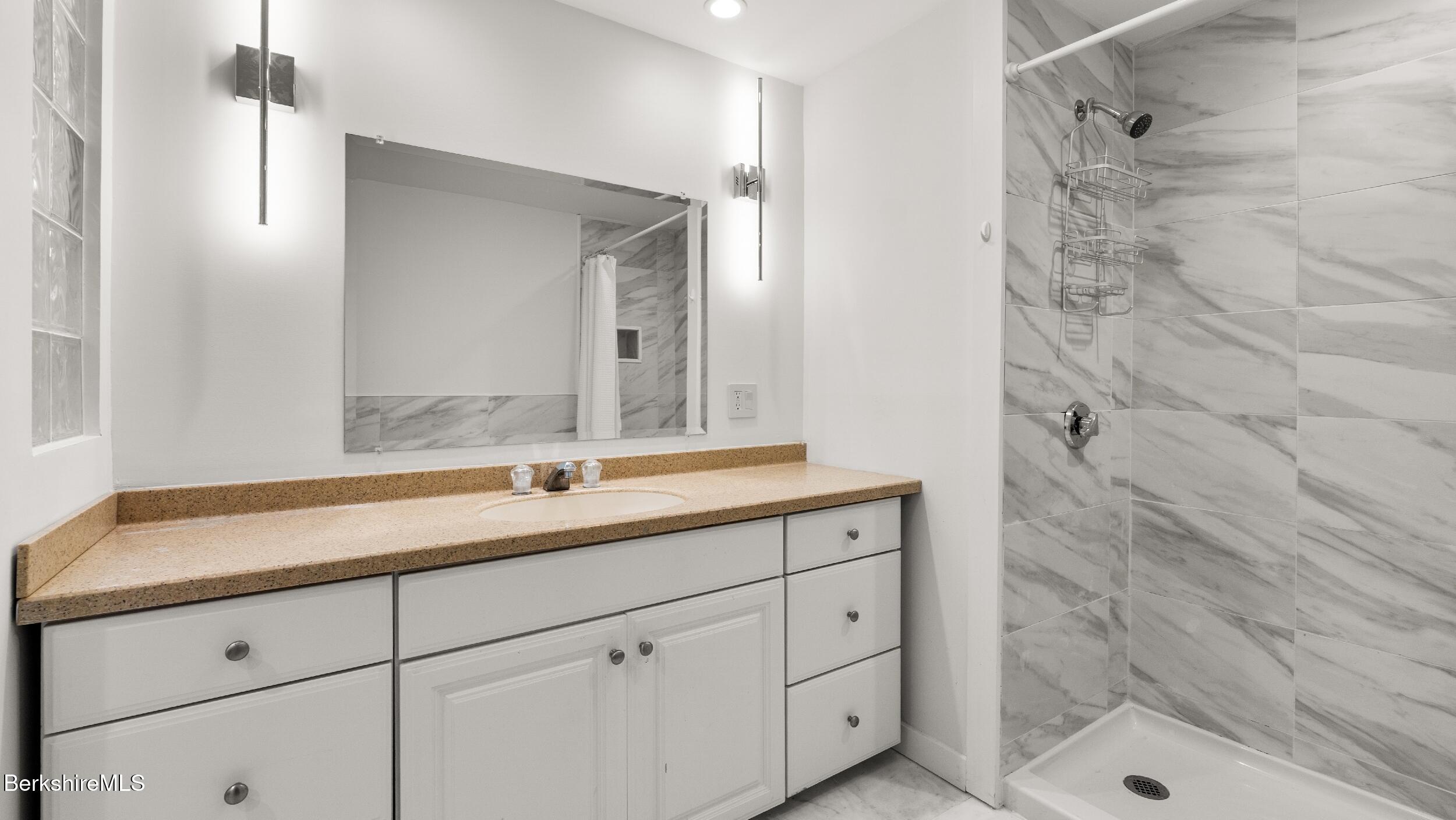 160 High Street Lee, MA 01238 - Photo 18 of 68 a bathroom with a sink and a mirror