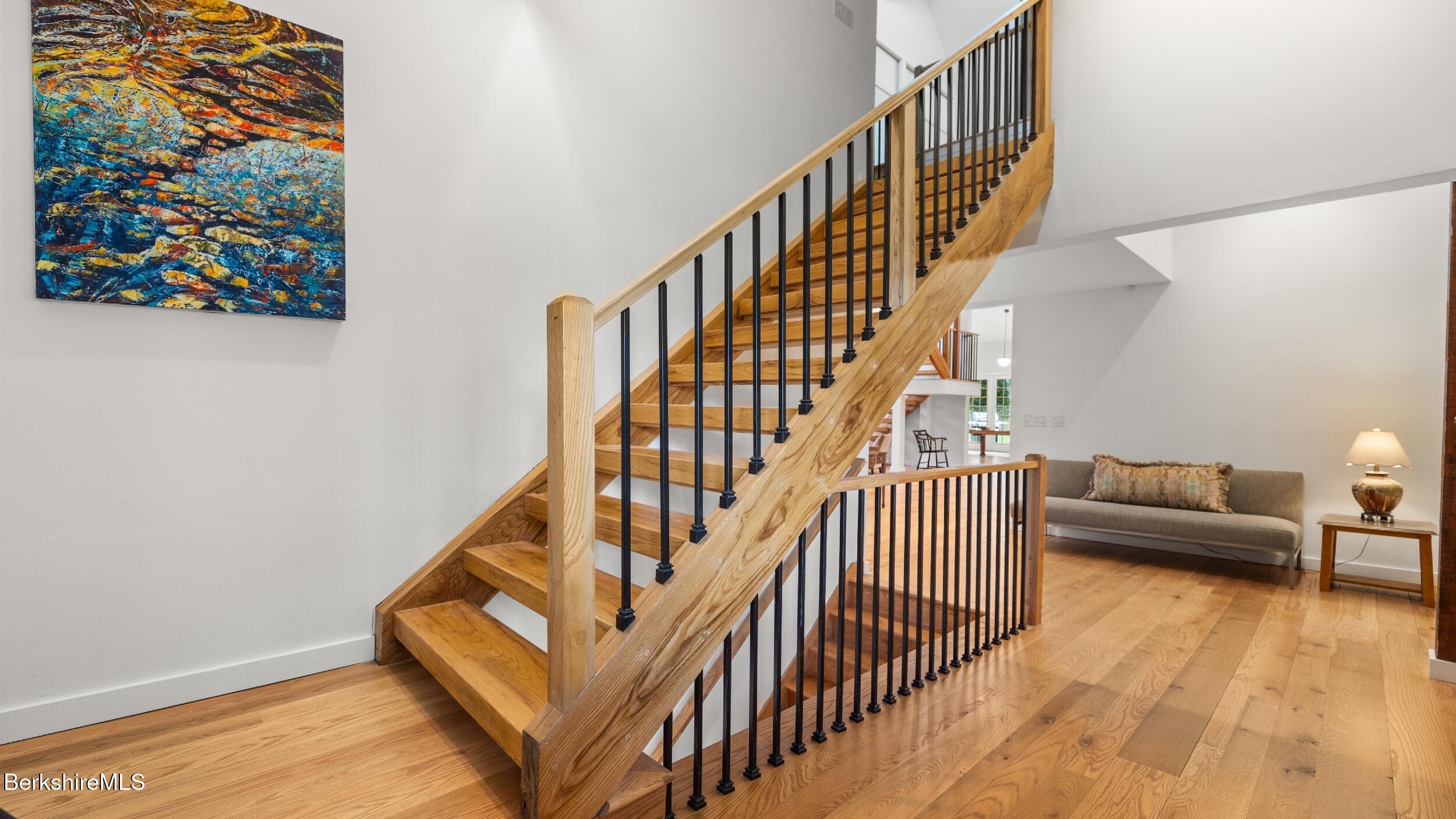 160 High Street Lee, MA 01238 - Photo 21 of 68 a view of entryway livingroom and hall with wooden floor