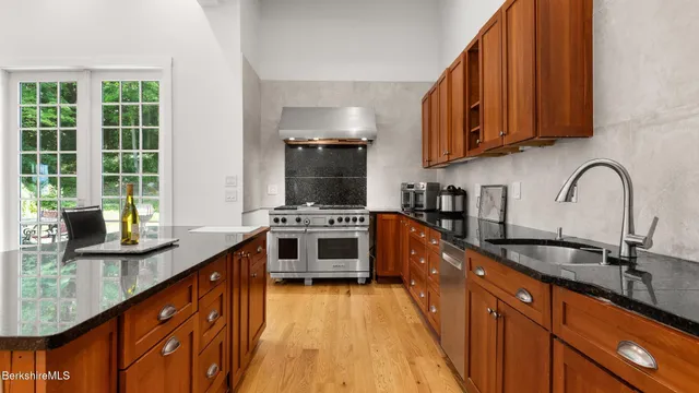 a bathroom with a granite countertop sink and vanity