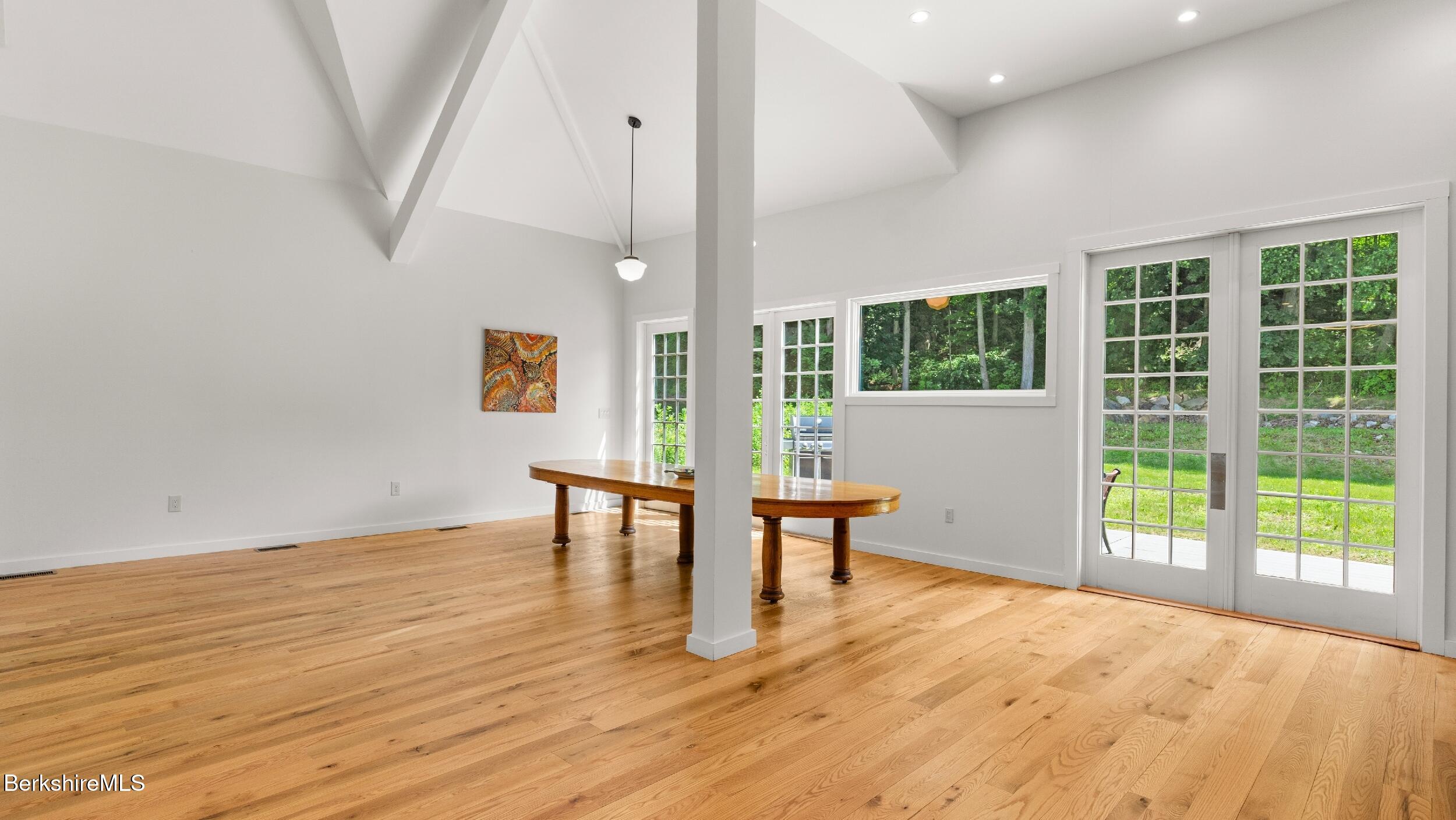160 High Street Lee, MA 01238 - Photo 24 of 68 a view of an empty room with a window and wooden floor