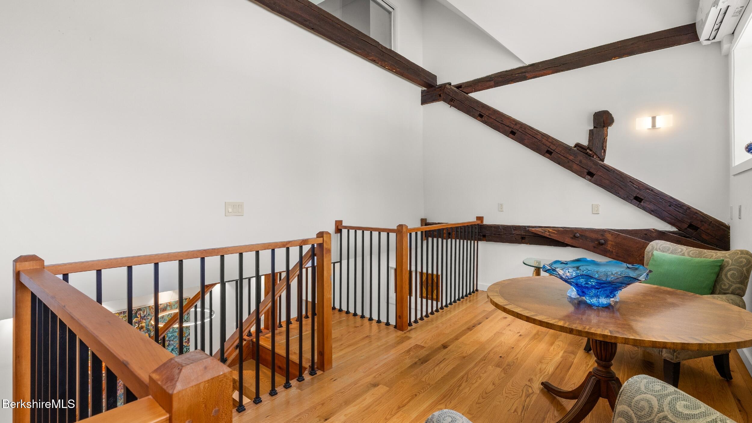 160 High Street Lee, MA 01238 - Photo 32 of 68 a balcony with wooden floor stairs and furniture