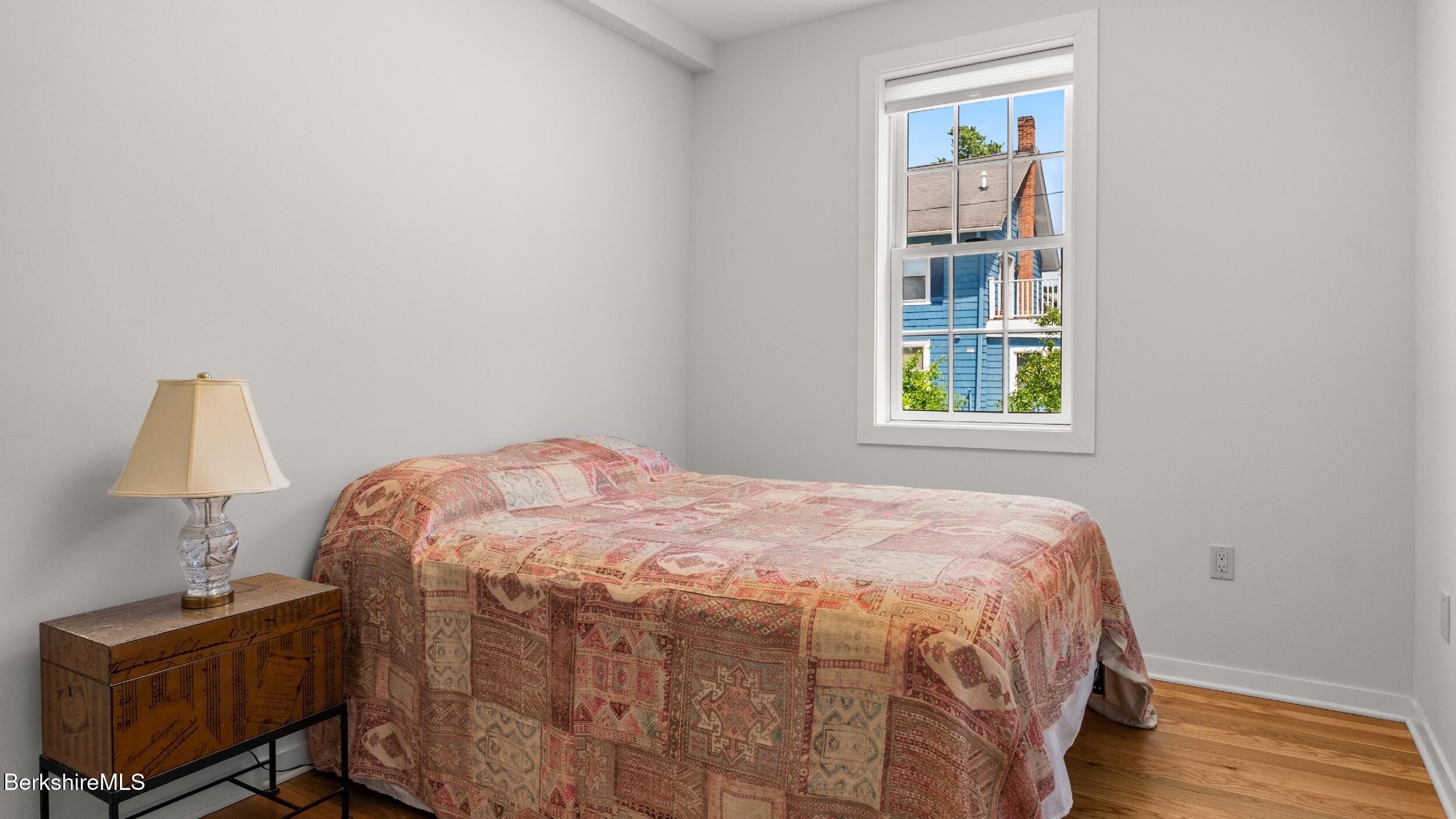 160 High Street Lee, MA 01238 - Photo 34 of 68 a bedroom with a bed and a window