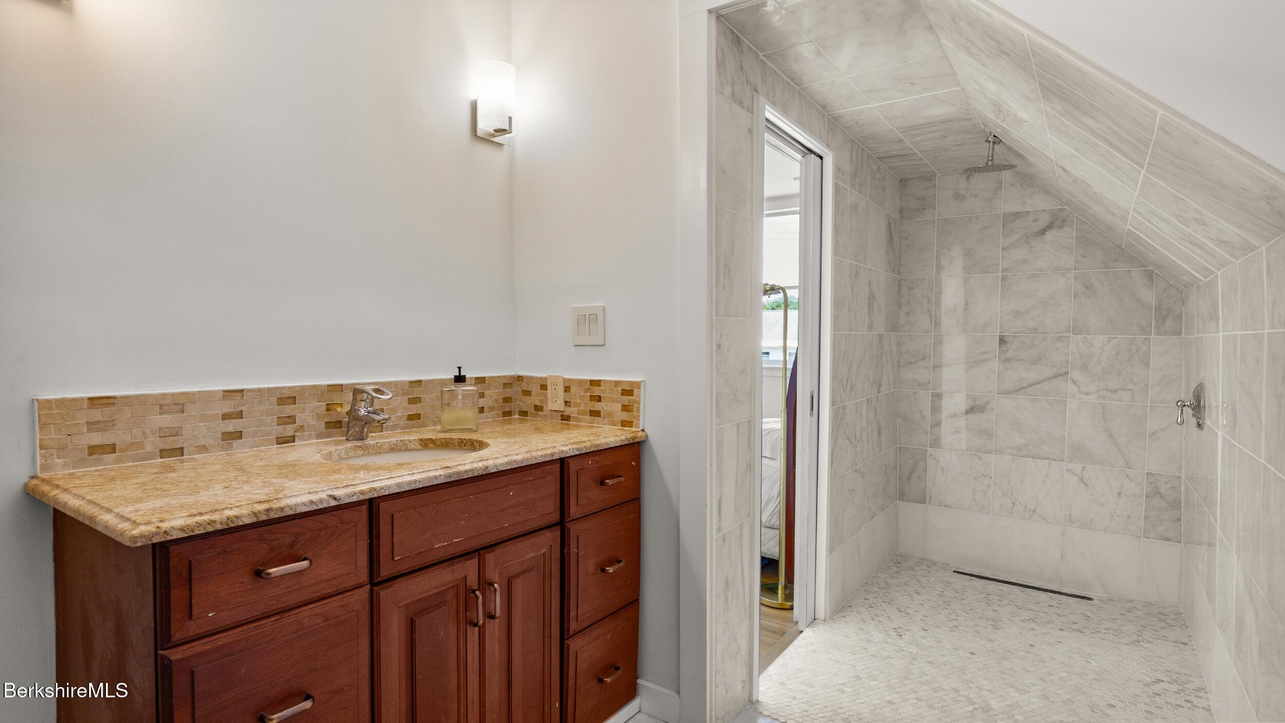 160 High Street Lee, MA 01238 - Photo 40 of 68 a bathroom with a granite countertop sink and a mirror