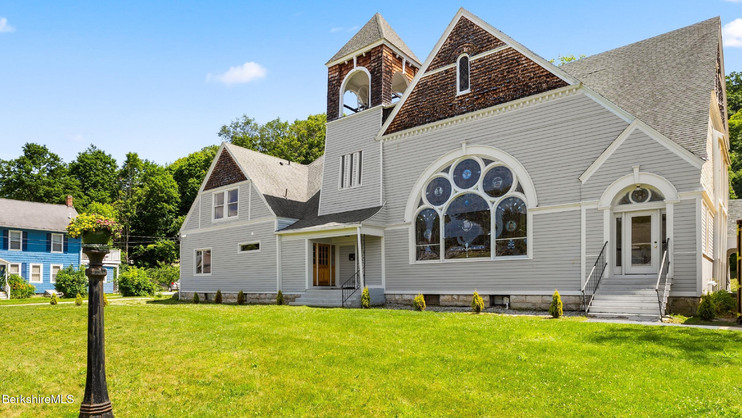 160 High Street Lee, MA 01238 - Photo 8 of 68 a front view of a house with a yard