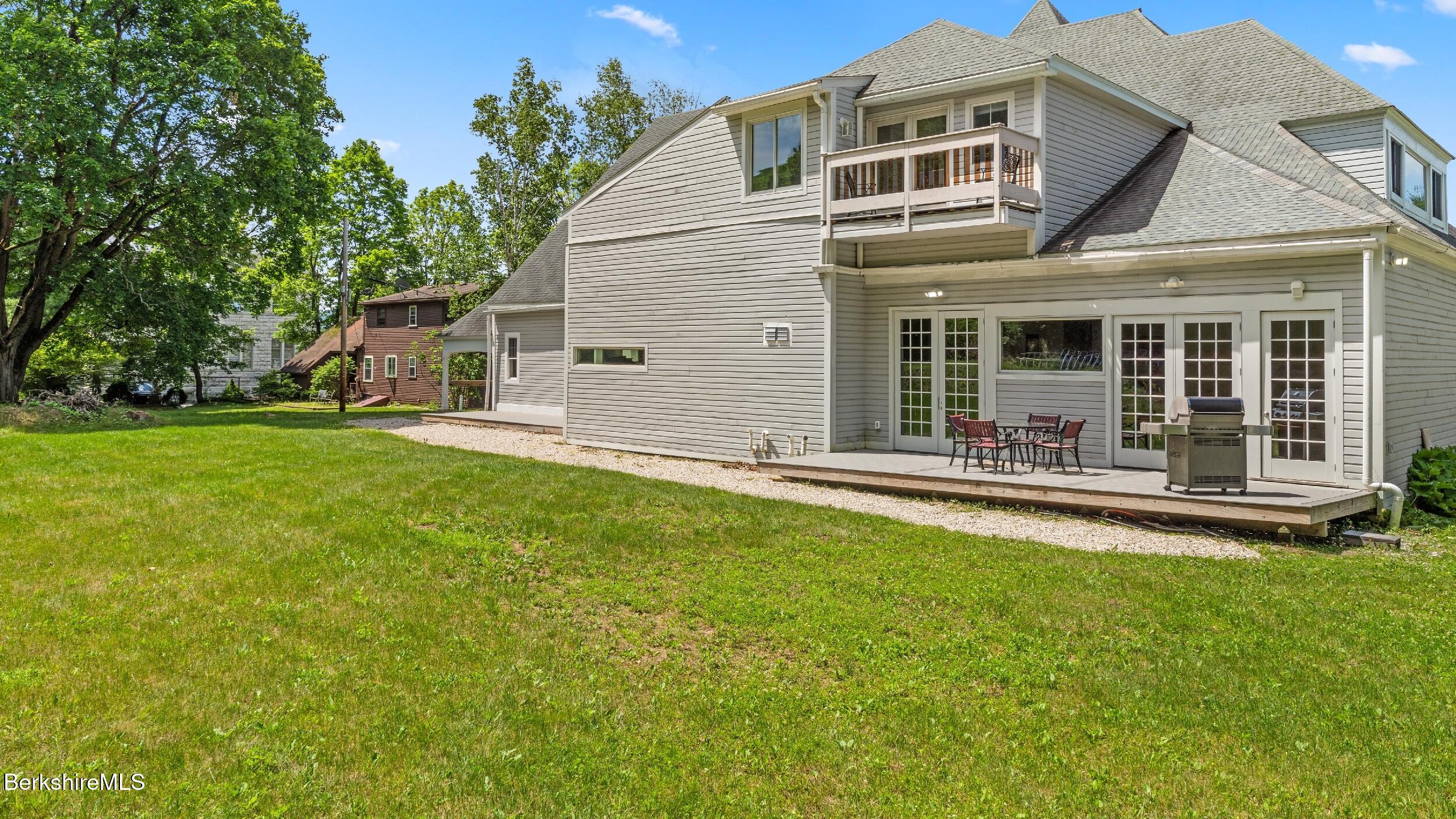 160 High Street Lee, MA 01238 - Photo 10 of 68 a view of a house with a yard and sitting area