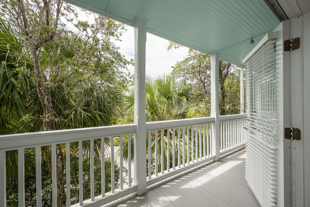 809 Washington Street, Unit 102 Key West, FL 33040 - Photo 18 of 33 a view of a balcony with wooden floor