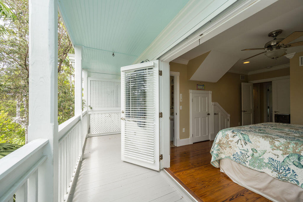 809 Washington Street, Unit 102 Key West, FL 33040 - Photo 20 of 33 a bedroom with a bed and a window