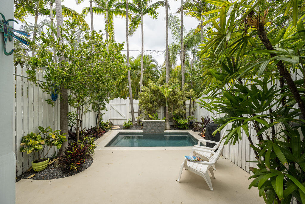 809 Washington Street, Unit 102 Key West, FL 33040 - Photo 32 of 33 a view of yard with swimming pool and furniture