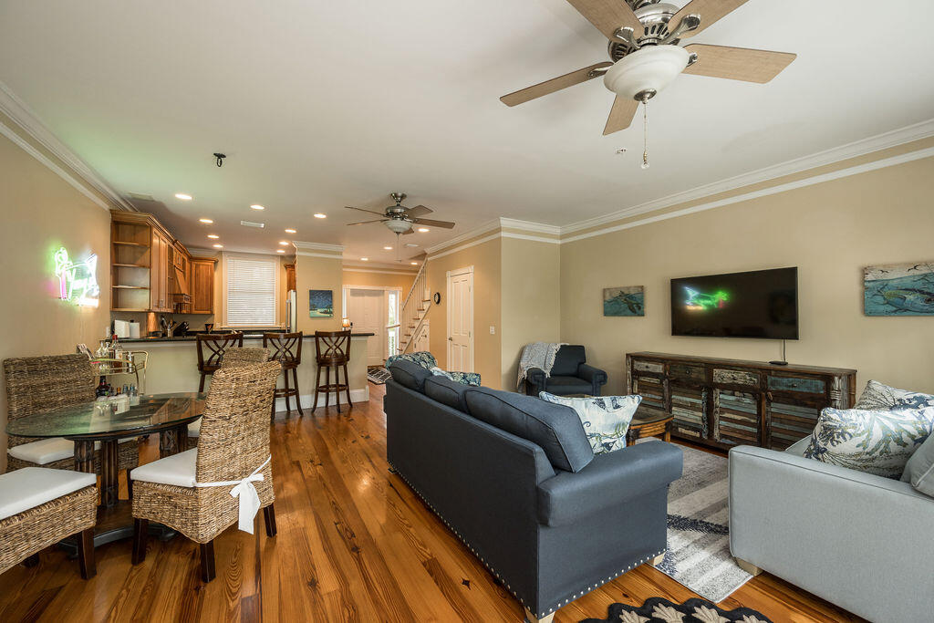 809 Washington Street, Unit 102 Key West, FL 33040 - Photo 8 of 33 a living room with furniture and a flat screen tv
