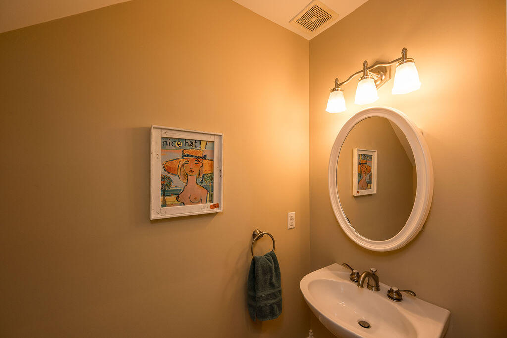 809 Washington Street, Unit 102 Key West, FL 33040 - Photo 9 of 33 a bathroom with a sink mirror and toilet