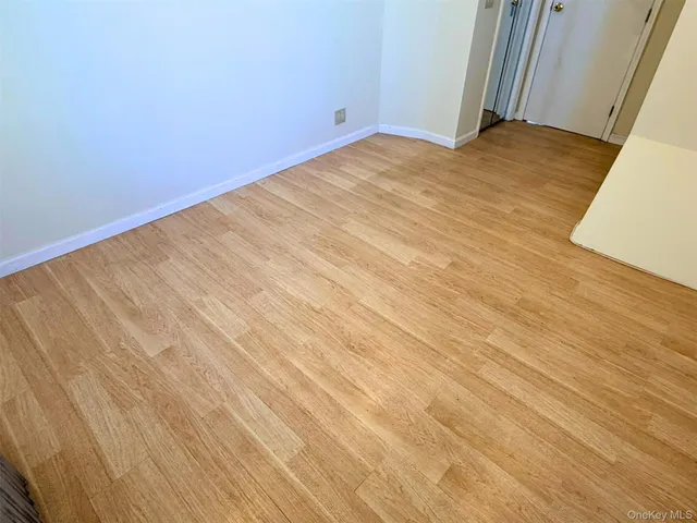 wooden floor and window in an empty room