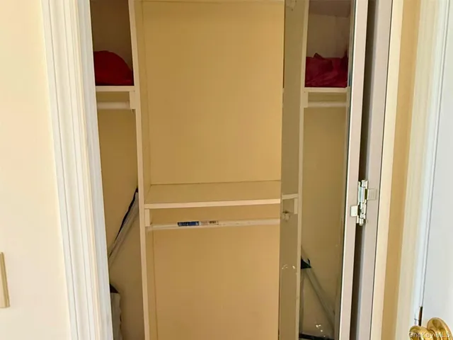 a bathroom with a sink mirror toilet and shower