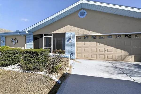 a view of a house with a garage