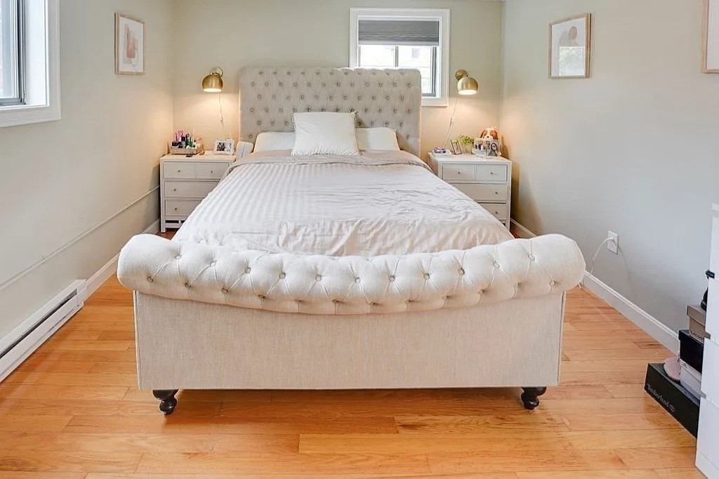 83 Nicholas Road, Unit H Framingham, MA 01701 - Photo 6 of 11 a bed sitting in a bedroom next to a window