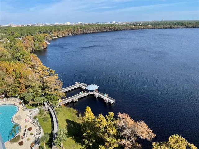 a view of a roof deck with wooden floor and seating space