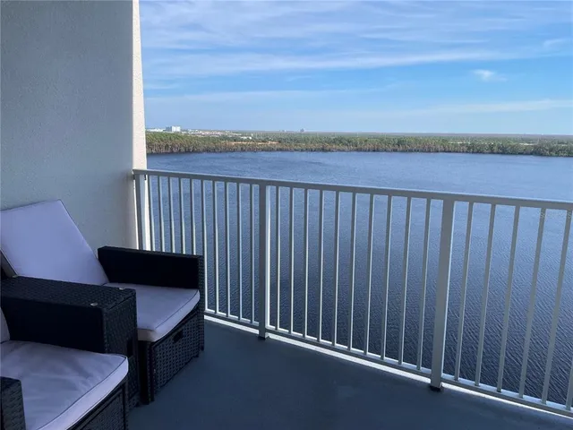 a kitchen with stainless steel appliances granite countertop a refrigerator sink and stove