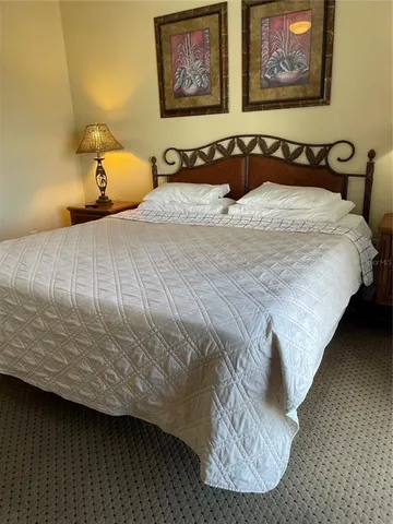 a bathroom with a sink a toilet a mirror and bathtub