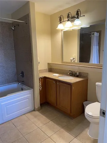 a bedroom with two beds and a window