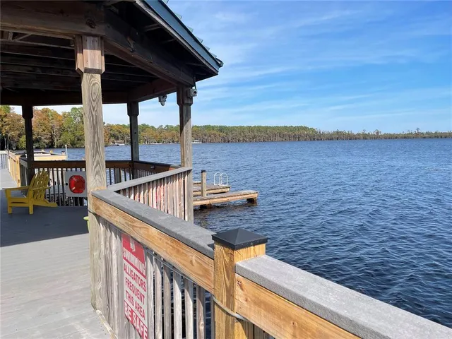a balcony with table and chairs