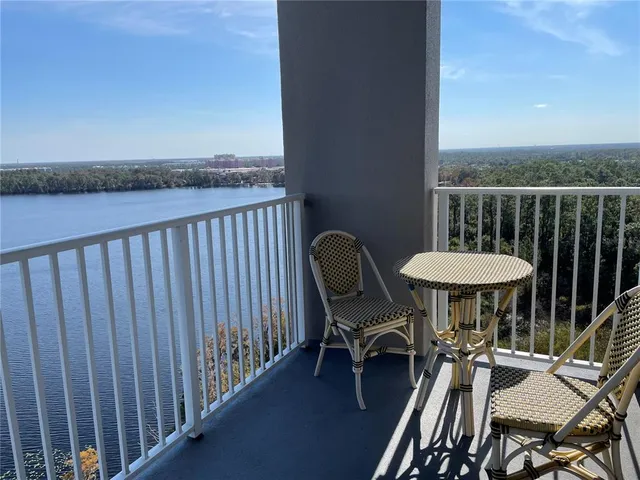a swimming pool with outdoor seating and yard
