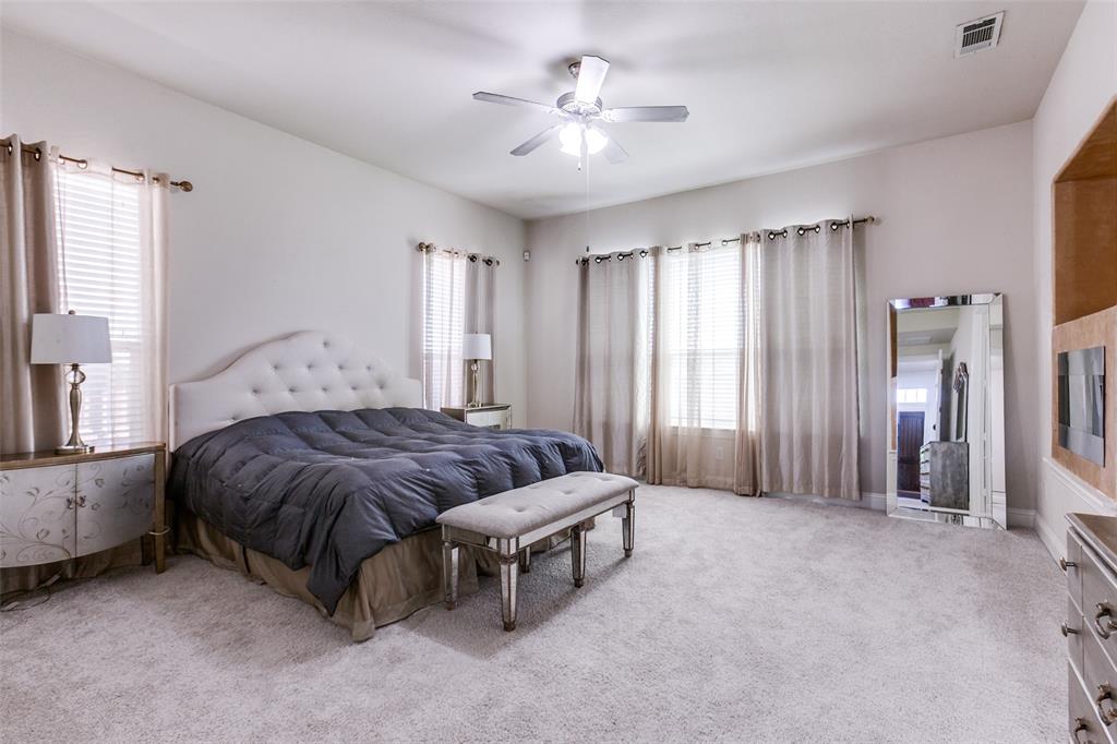 3620 Acropolis Way Plano, TX 75074 - Photo 13 of 25 a spacious bedroom with a bed and a chandelier