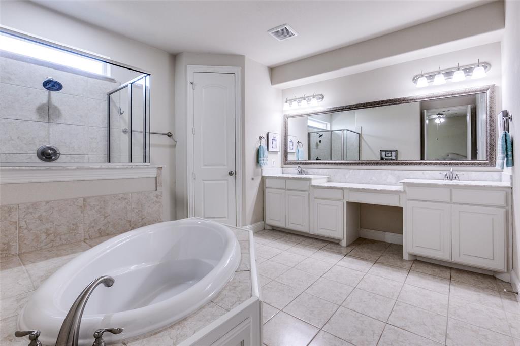 3620 Acropolis Way Plano, TX 75074 - Photo 15 of 25 a bathroom with a tub sink and mirror