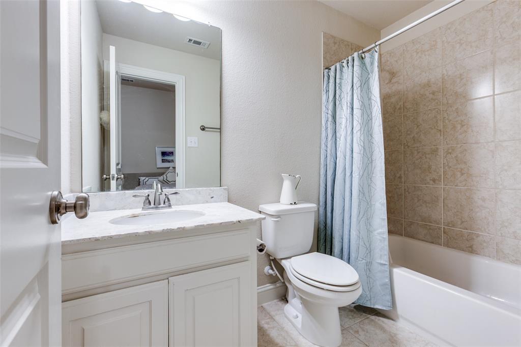 3620 Acropolis Way Plano, TX 75074 - Photo 19 of 25 a bathroom with a sink a toilet and shower