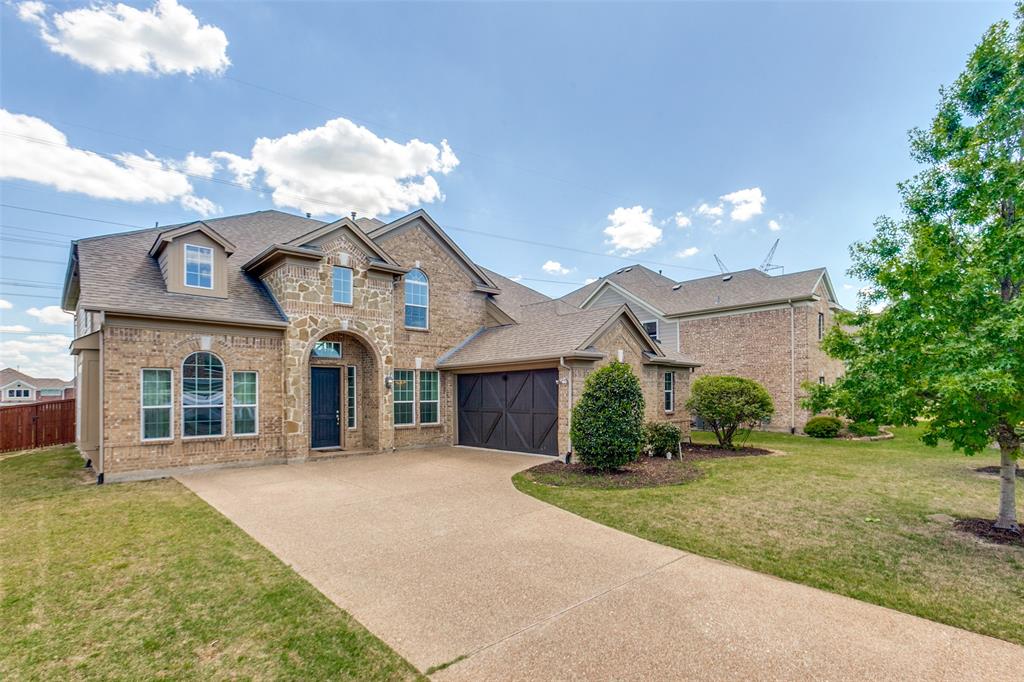 3620 Acropolis Way Plano, TX 75074 - Photo 2 of 25 a front view of a house with a yard and garage