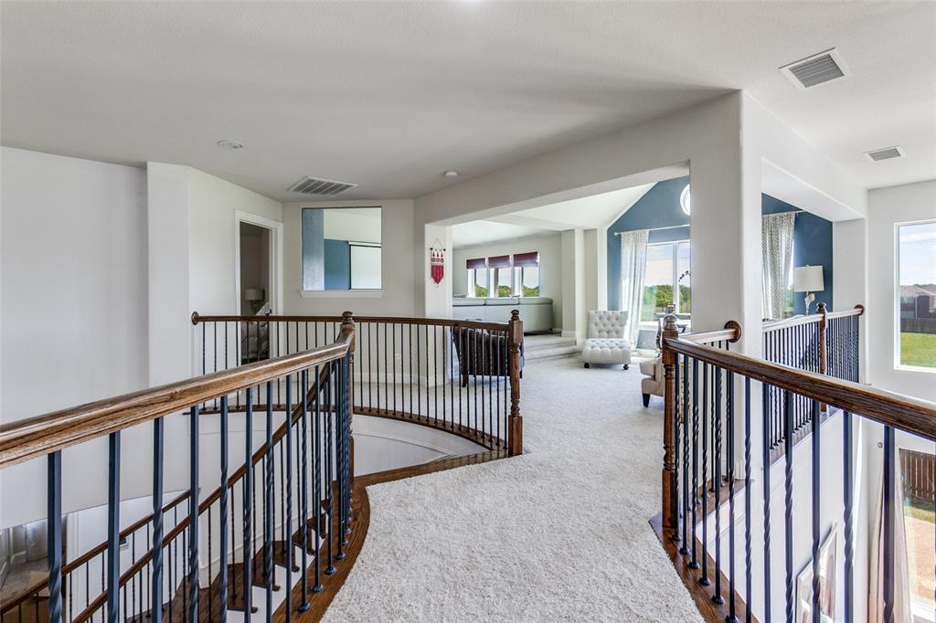 3620 Acropolis Way Plano, TX 75074 - Photo 21 of 25 a view of a hallway with wooden floor and windows