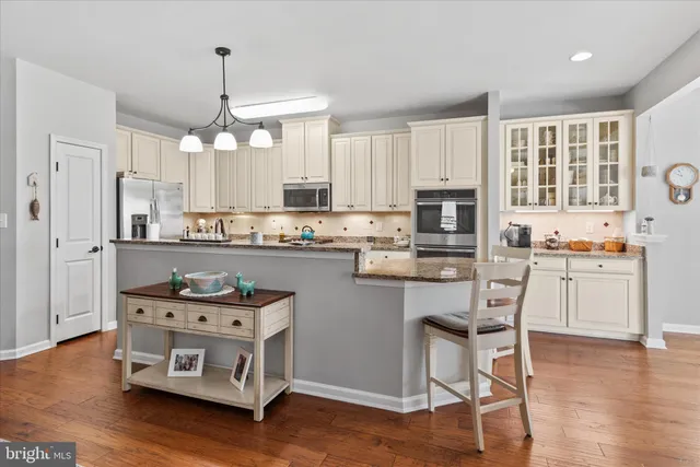 a bathroom with a sink mirror and vanity