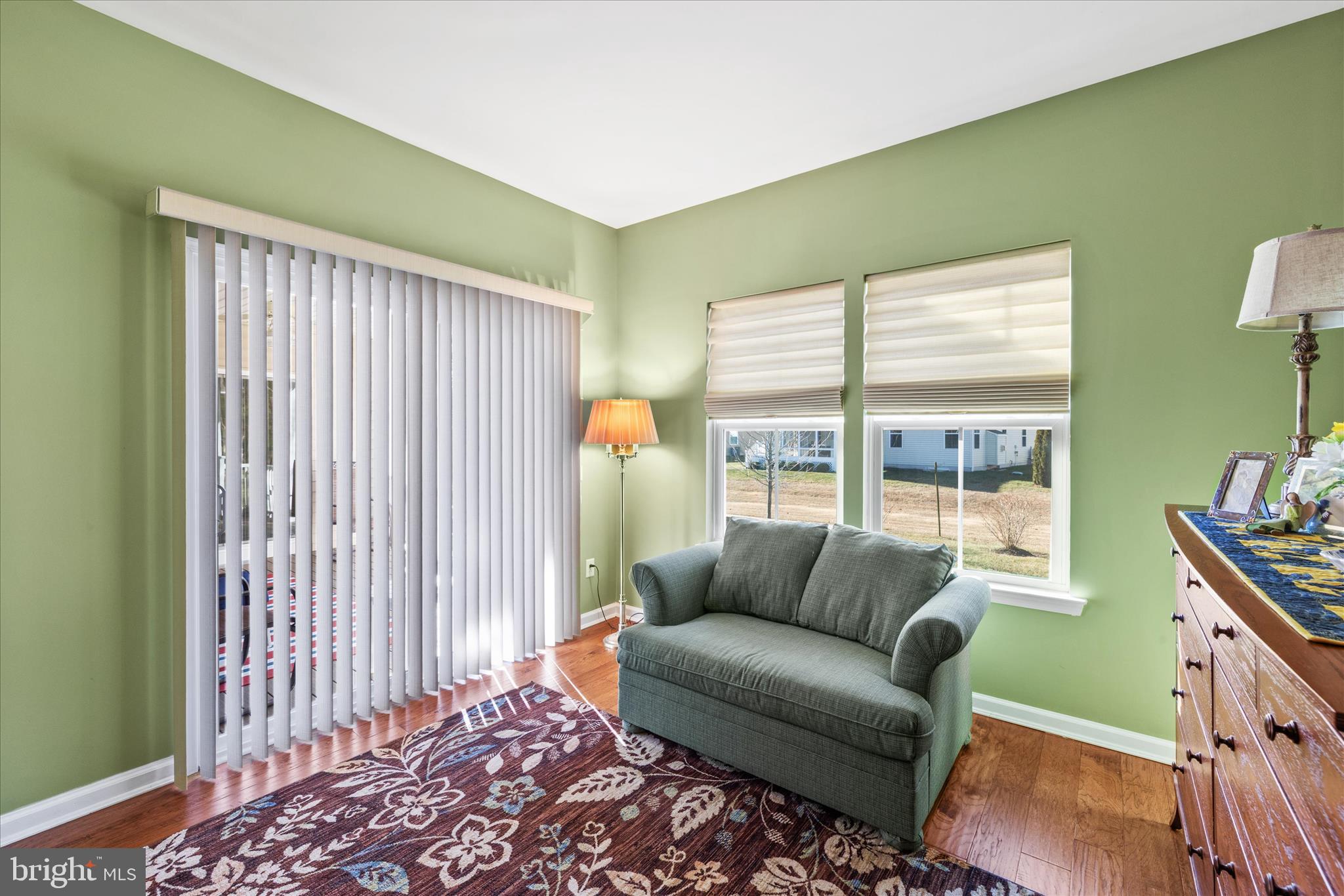 21329 North Acorn Way Lewes, DE 19958 - Photo 32 of 68 a living room with furniture and a window