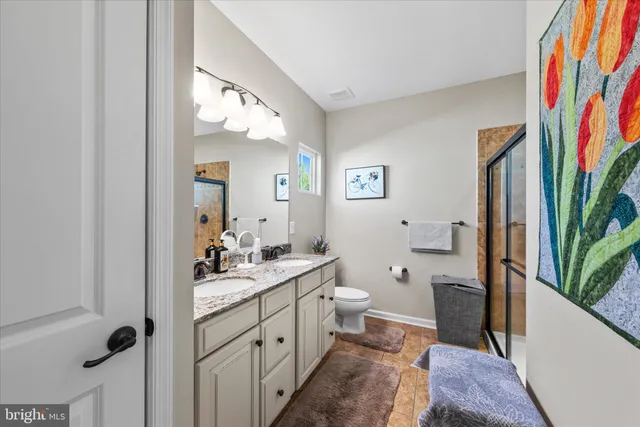 a bathroom with a sink a mirror and a shower