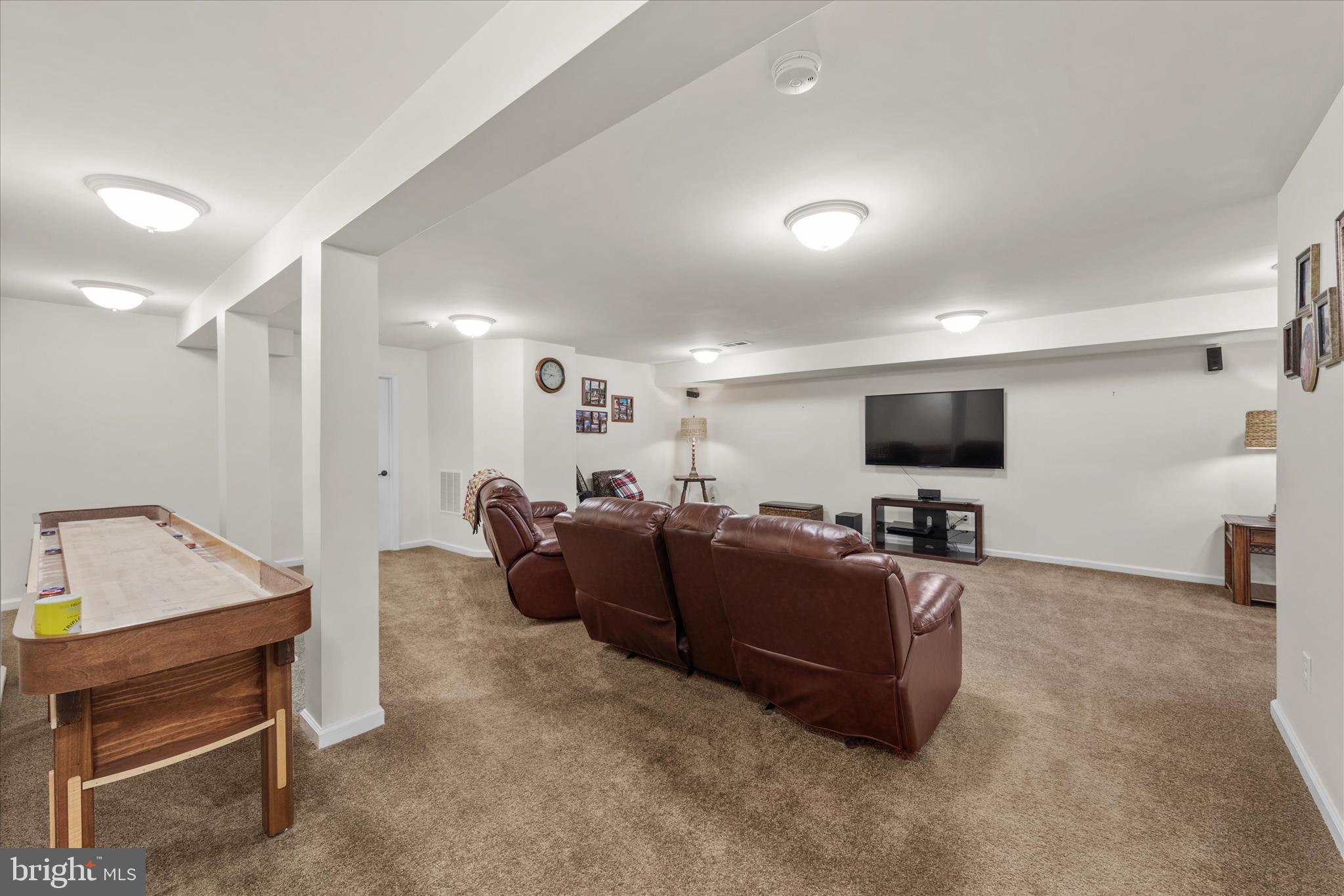 21329 North Acorn Way Lewes, DE 19958 - Photo 51 of 68 a living room with furniture and a flat screen tv