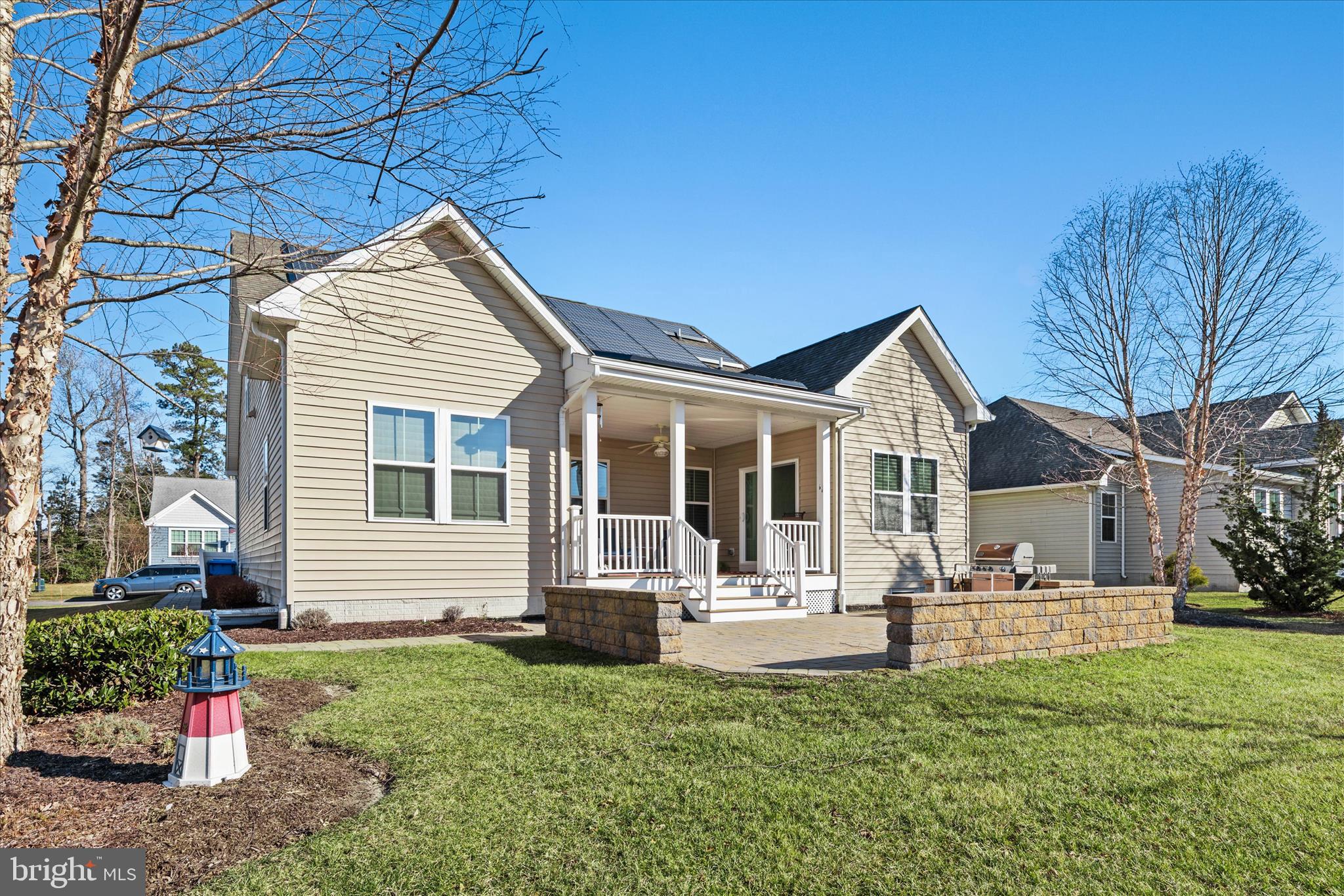 21329 North Acorn Way Lewes, DE 19958 - Photo 66 of 68 a front view of a house with a yard