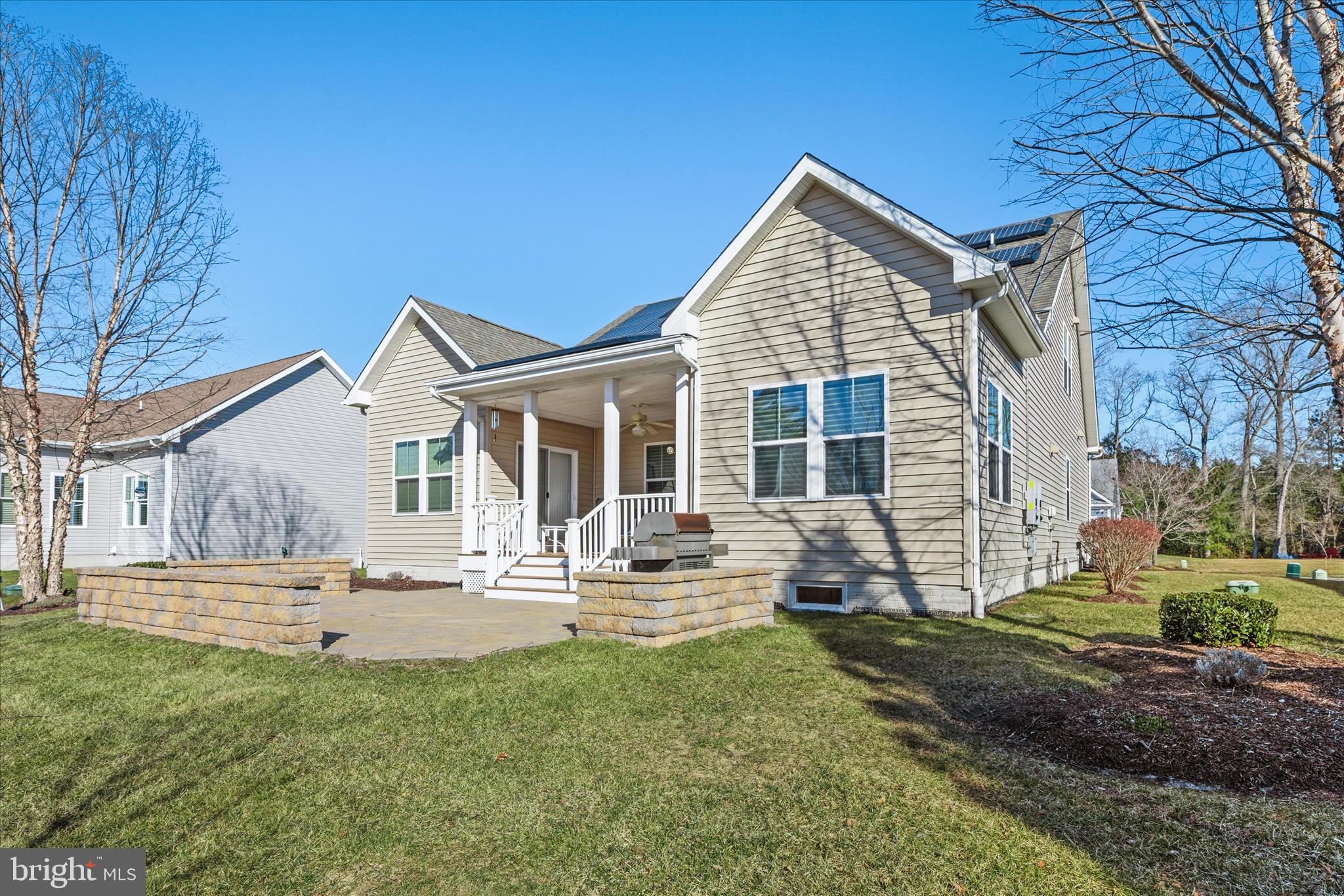 21329 North Acorn Way Lewes, DE 19958 - Photo 68 of 68 a view of a house with a yard and sitting area