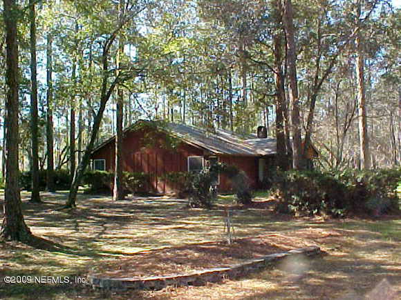 207 Cornell Road St. Augustine, FL 32086 - Photo 1 of 1 a view of a house with a snow on the road