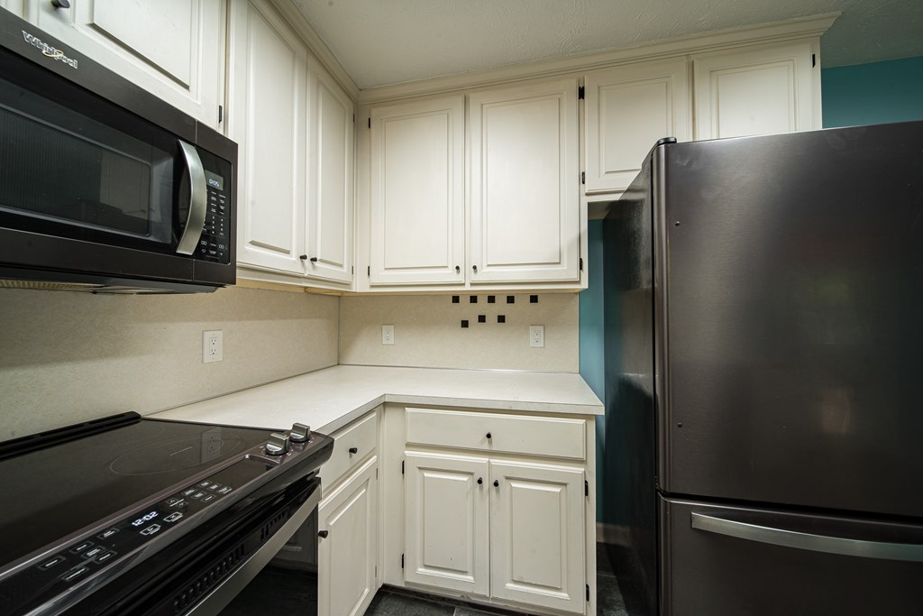 39 West Scotch Drive Fortson, GA 31808 - Photo 11 of 34 a kitchen with stainless steel appliances a refrigerator and a stove top oven