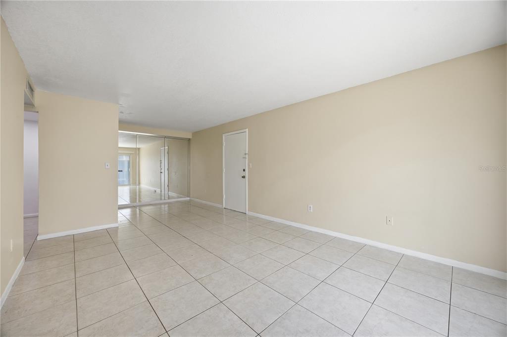 925 West Oak Ridge Road, Unit 925C Orlando, FL 32809 - Photo 3 of 15 a view of an empty room and window