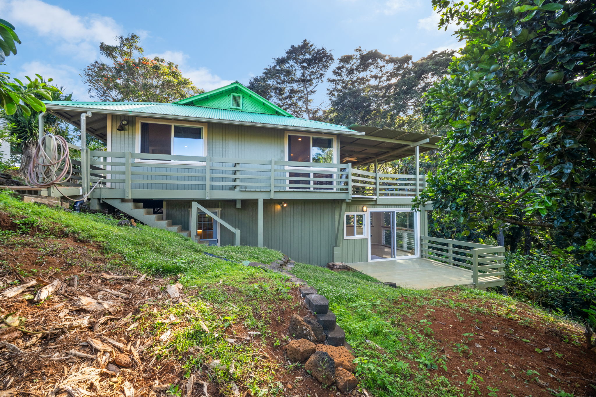 6050 C Kapahi Road Kapaa, HI 96746 - Photo 1 of 30 a front view of a house with garden