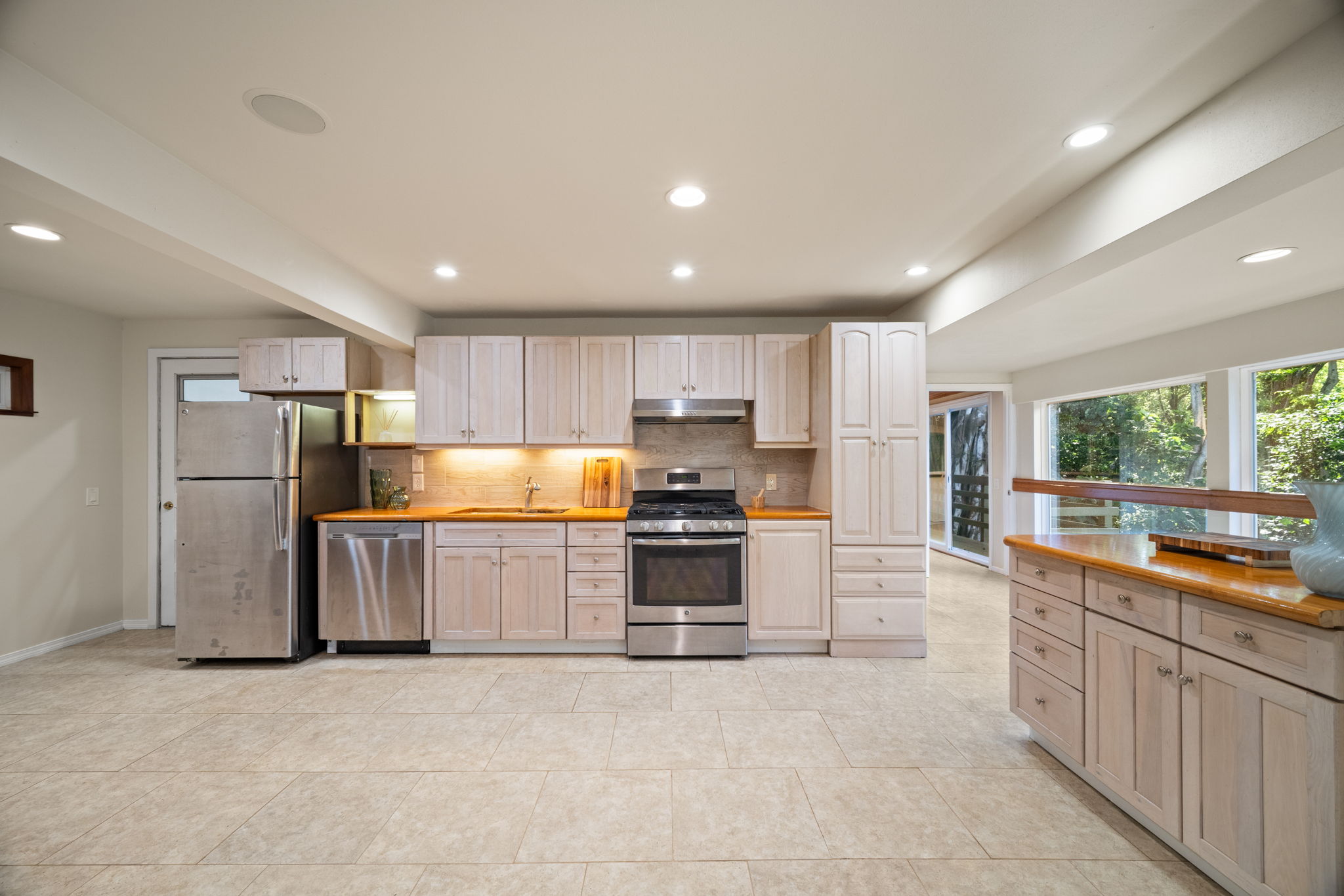 6050 C Kapahi Road Kapaa, HI 96746 - Photo 19 of 30 a kitchen with refrigerator and cabinets