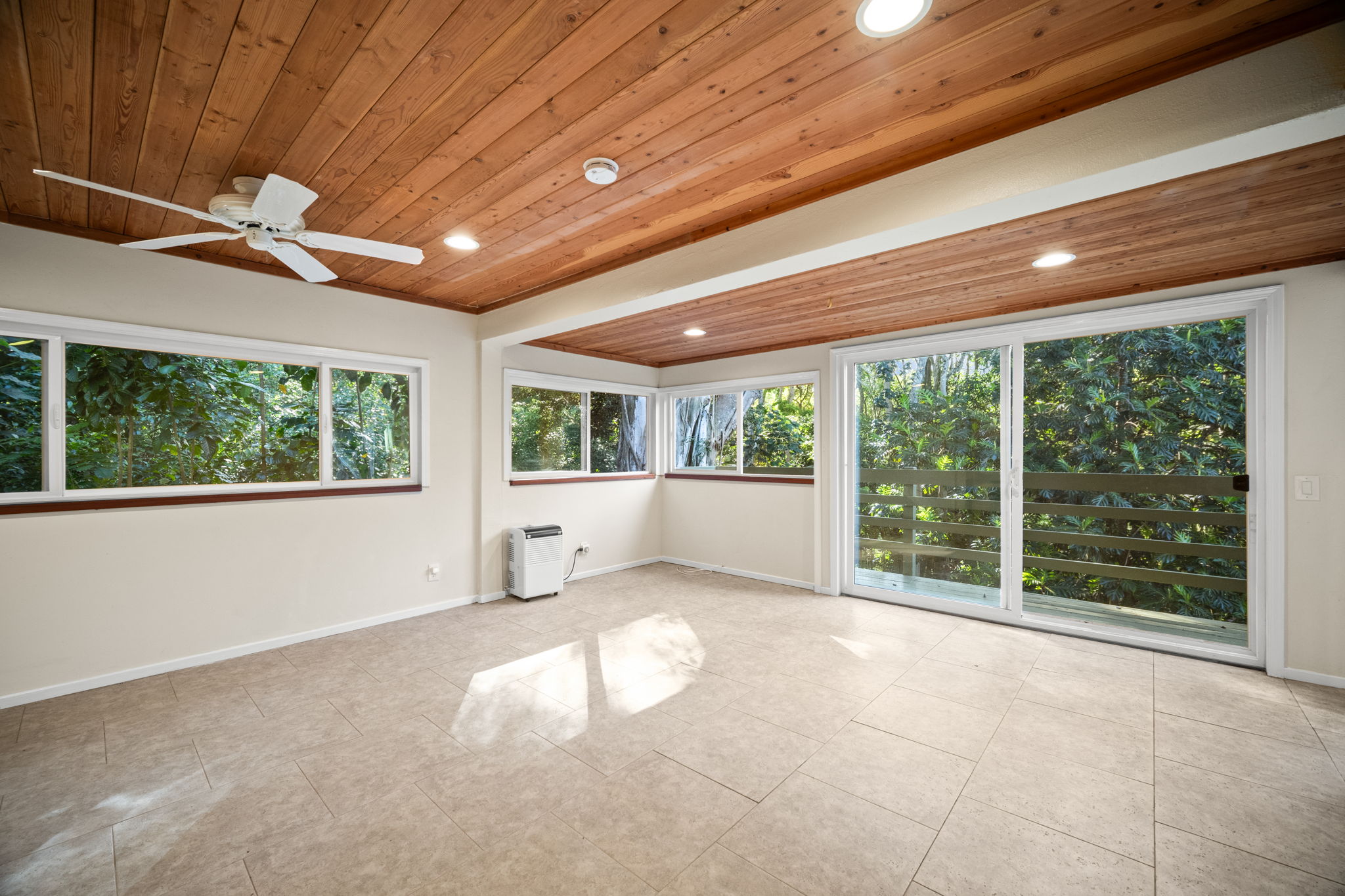 6050 C Kapahi Road Kapaa, HI 96746 - Photo 23 of 30 a view of an empty room with a window and balcony