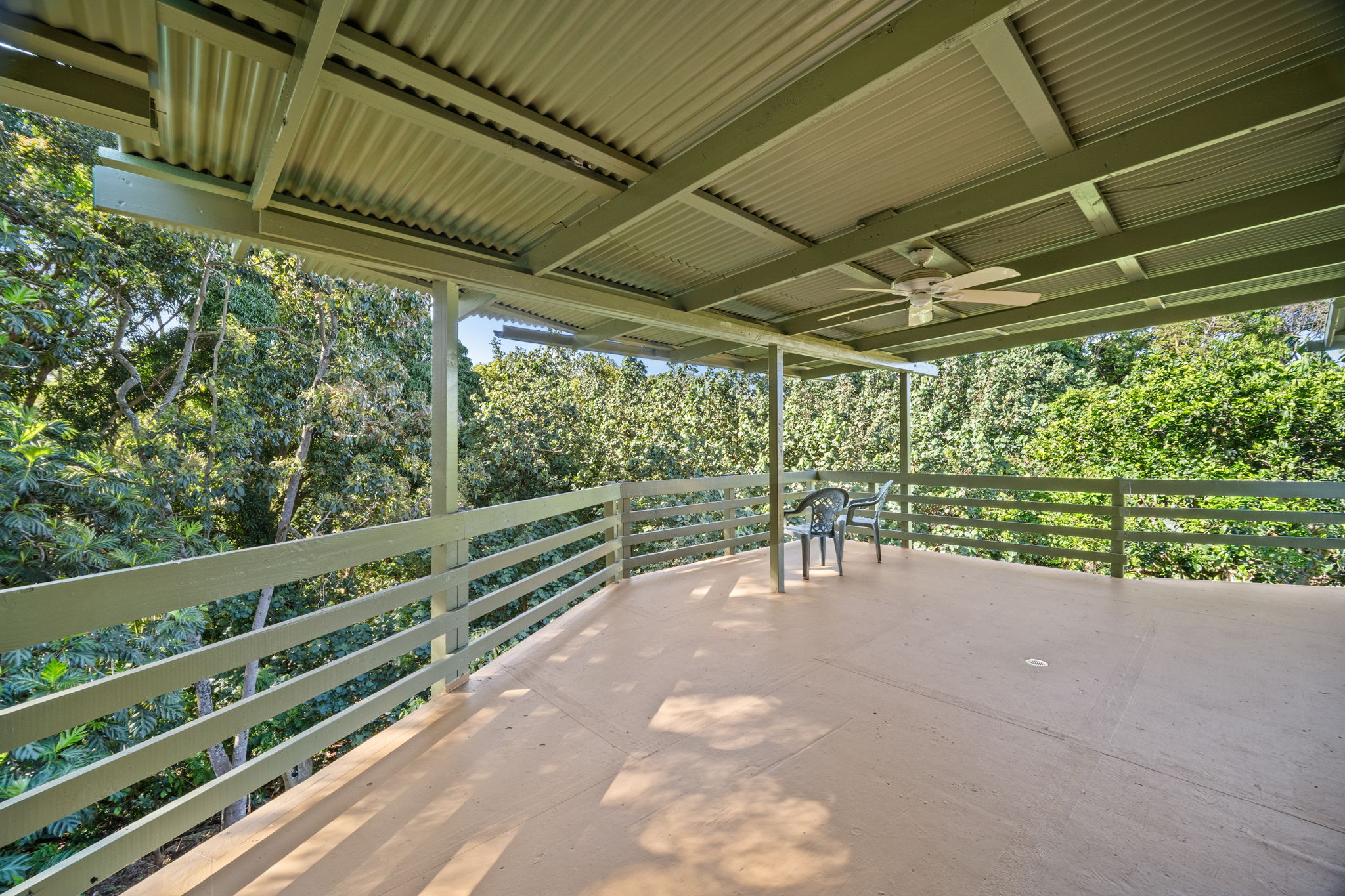 6050 C Kapahi Road Kapaa, HI 96746 - Photo 4 of 30 a view of a patio with table and chairs and wooden fence