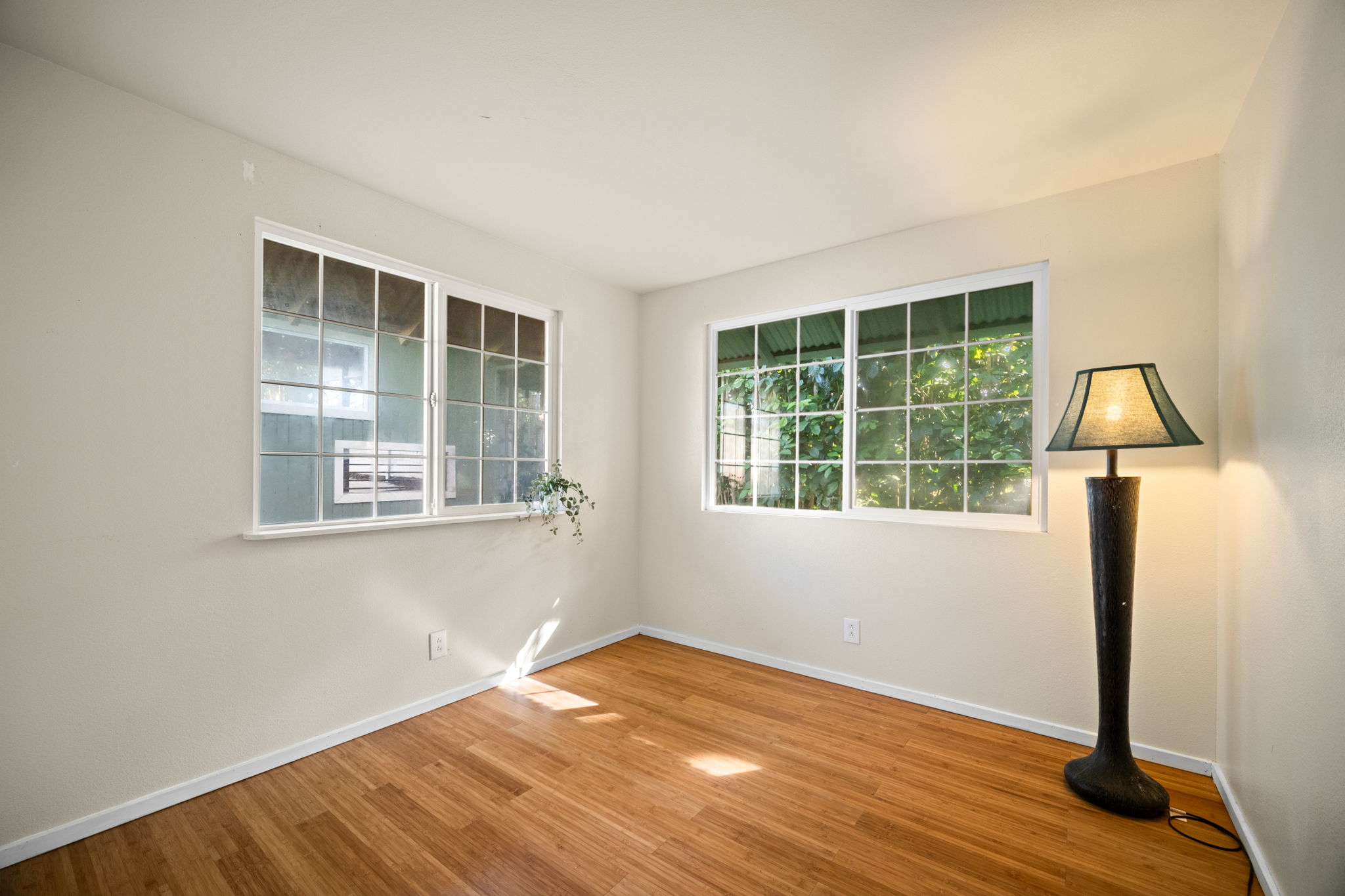 6050 C Kapahi Road Kapaa, HI 96746 - Photo 10 of 30 a view of empty room with wooden floor and fan