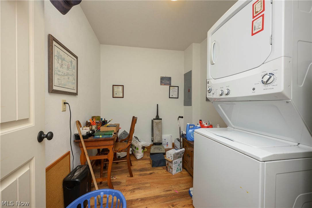 9427 Stonecreek Road Southwest Newcomerstown, OH 43832 - Photo 24 of 29 Dedicated laundry area featuring a stacked washer and dryer unit