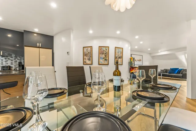 a kitchen with stainless steel appliances kitchen island granite countertop a refrigerator and a stove top oven