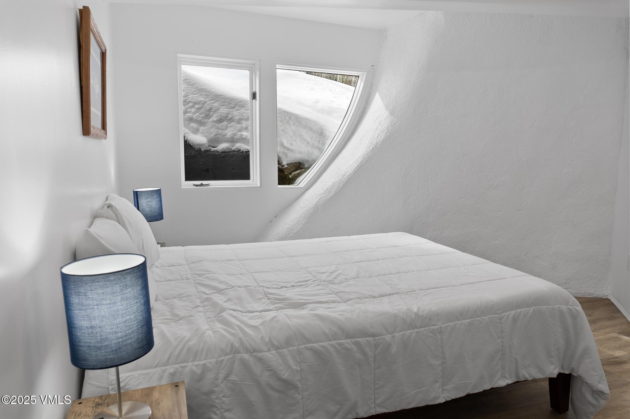 2940 Basingdale Boulevard, Unit 2 Vail, CO 81657 - Photo 23 of 28 a bedroom with a bed and window