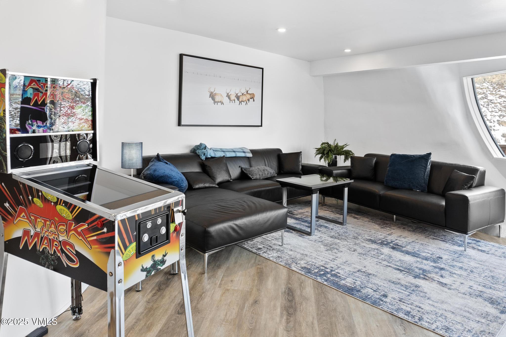 2940 Basingdale Boulevard, Unit 2 Vail, CO 81657 - Photo 8 of 28 a living room with furniture and kitchen view