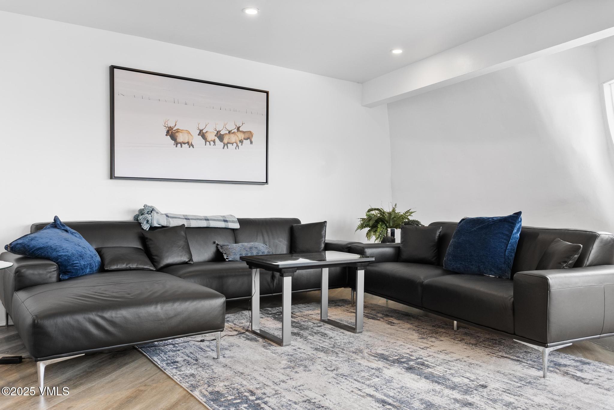 2940 Basingdale Boulevard, Unit 2 Vail, CO 81657 - Photo 9 of 28 a living room with furniture and a couch